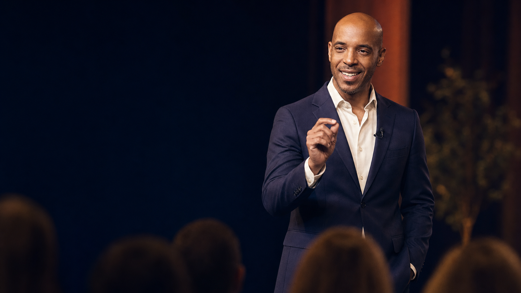 Brant Richards speaking on stage