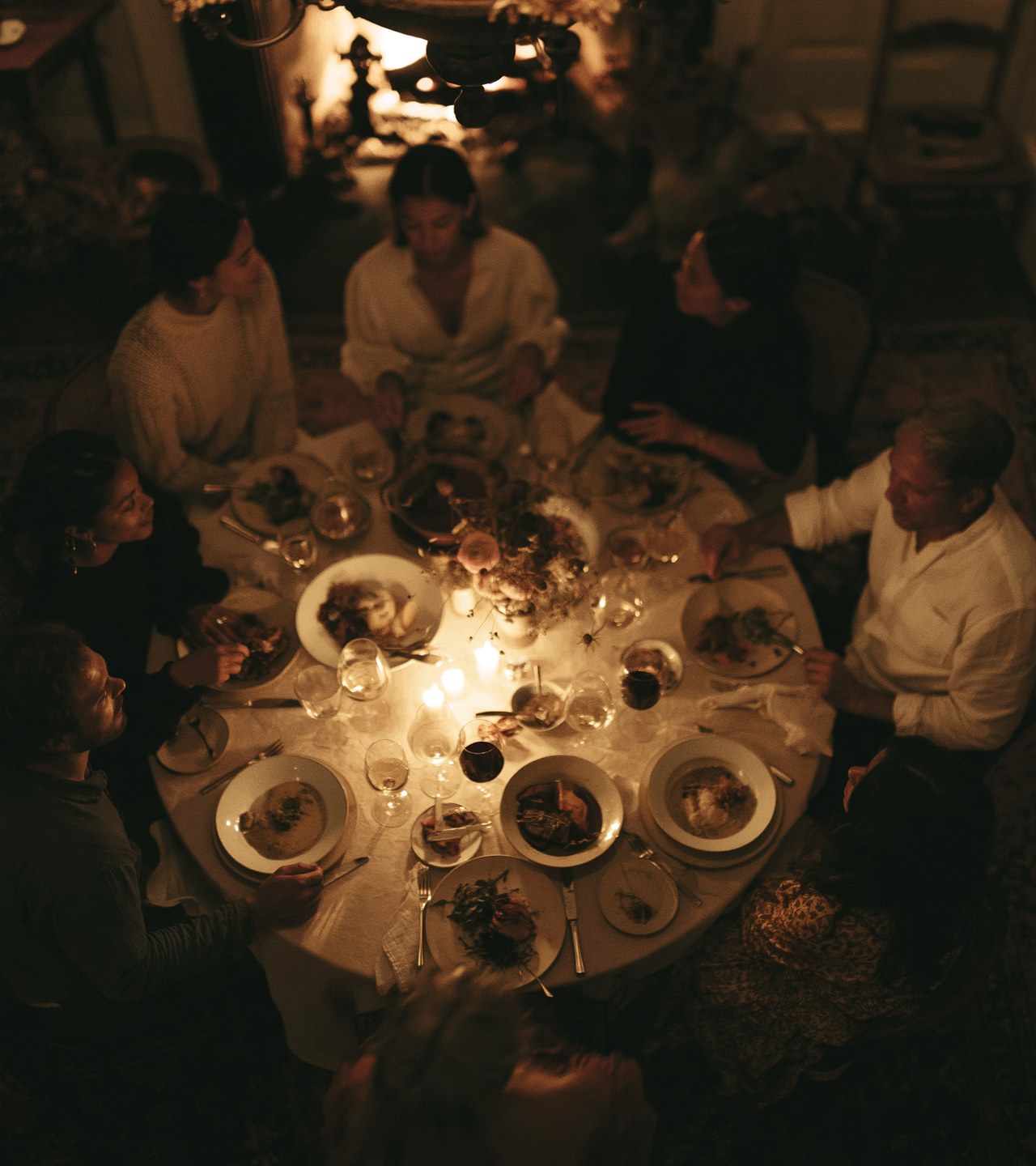 A candlelit table gathering